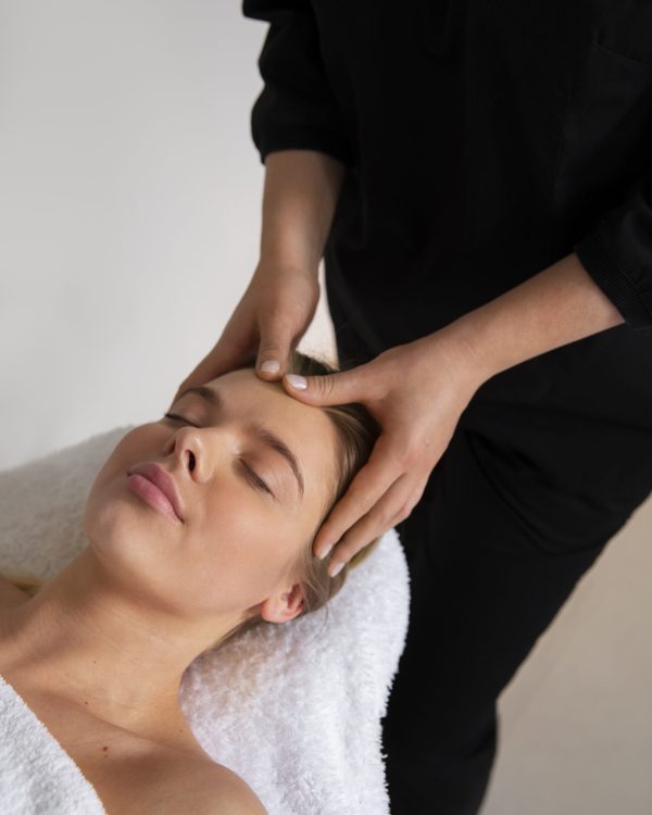 female-masseur-giving-back-massage-client